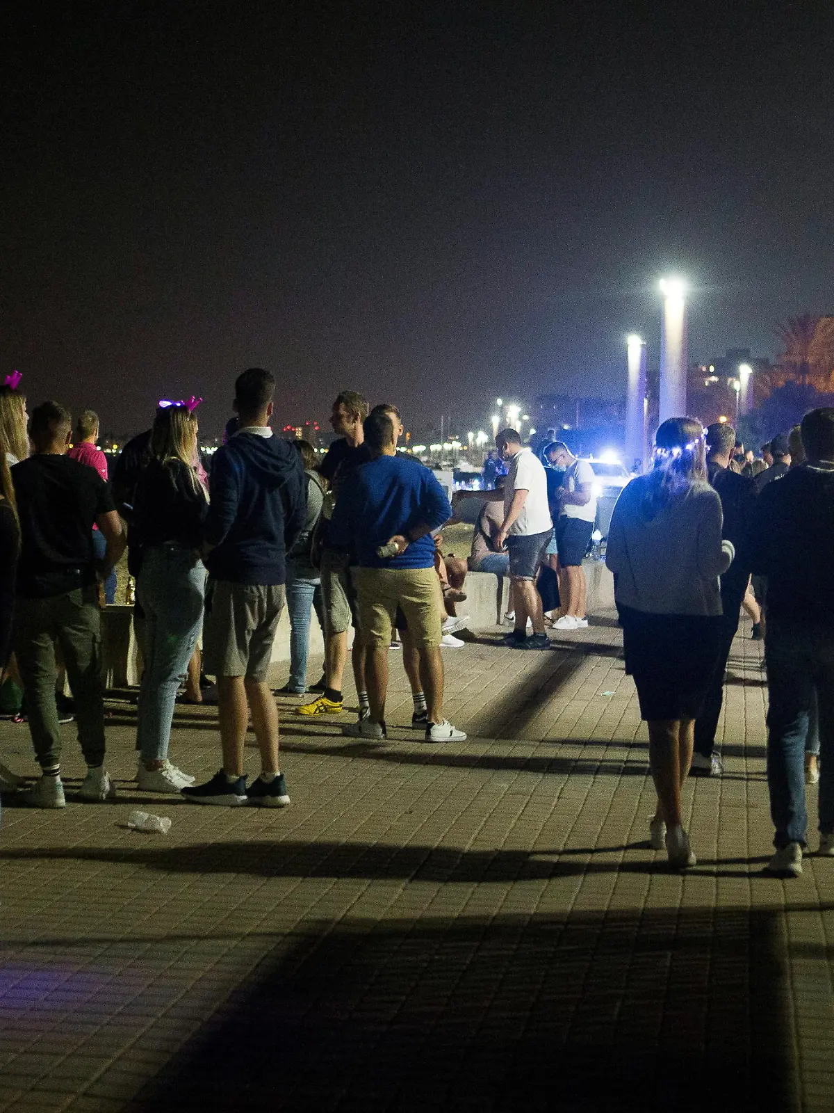 People party in Playa de Palma beach on the island of Mallorca, as Spanish regions with a low coronavirus disease (COVID-19) infection rate were allowed to reopen nightlife with some restrictions, in Mallorca, Spain, June 5, 2021. REUTERS/Enrique Calvo