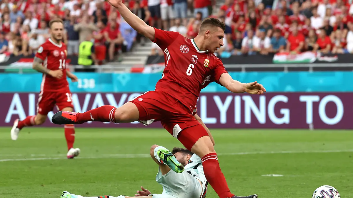 BUDAPEST, HUNGARY - JUNE 15: Rafa Silva of Portugal is fouled by Willi Orban of Hungary leading to a penalty being awarded during the UEFA Euro 2020 Championship Group F match between Hungary and Portugal at Puskas Arena on June 15, 2021 in Budapest, Hungary. (Photo by Bernadett Szabo - Pool/Getty Images)