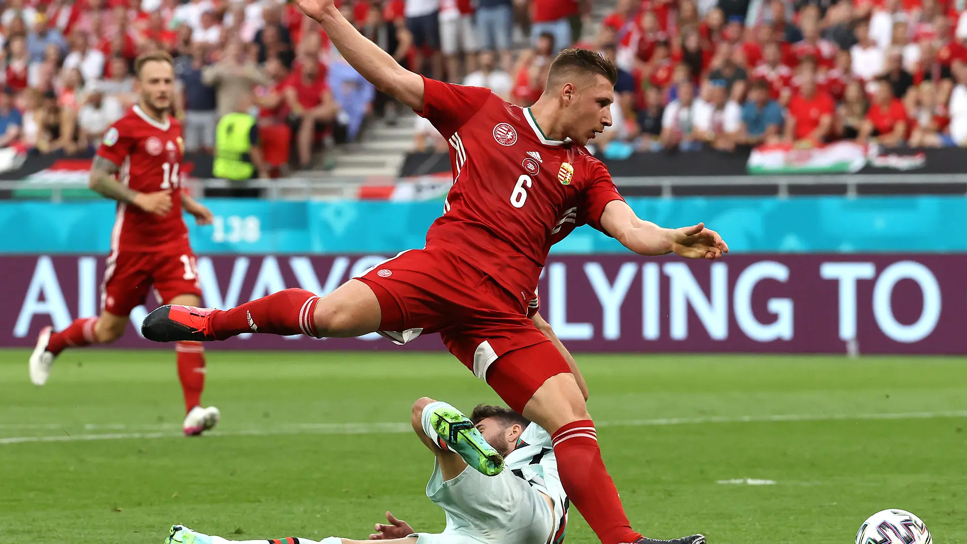 BUDAPEST, HUNGARY - JUNE 15: Rafa Silva of Portugal is fouled by Willi Orban of Hungary leading to a penalty being awarded during the UEFA Euro 2020 Championship Group F match between Hungary and Portugal at Puskas Arena on June 15, 2021 in Budapest, Hungary. (Photo by Bernadett Szabo - Pool/Getty Images)