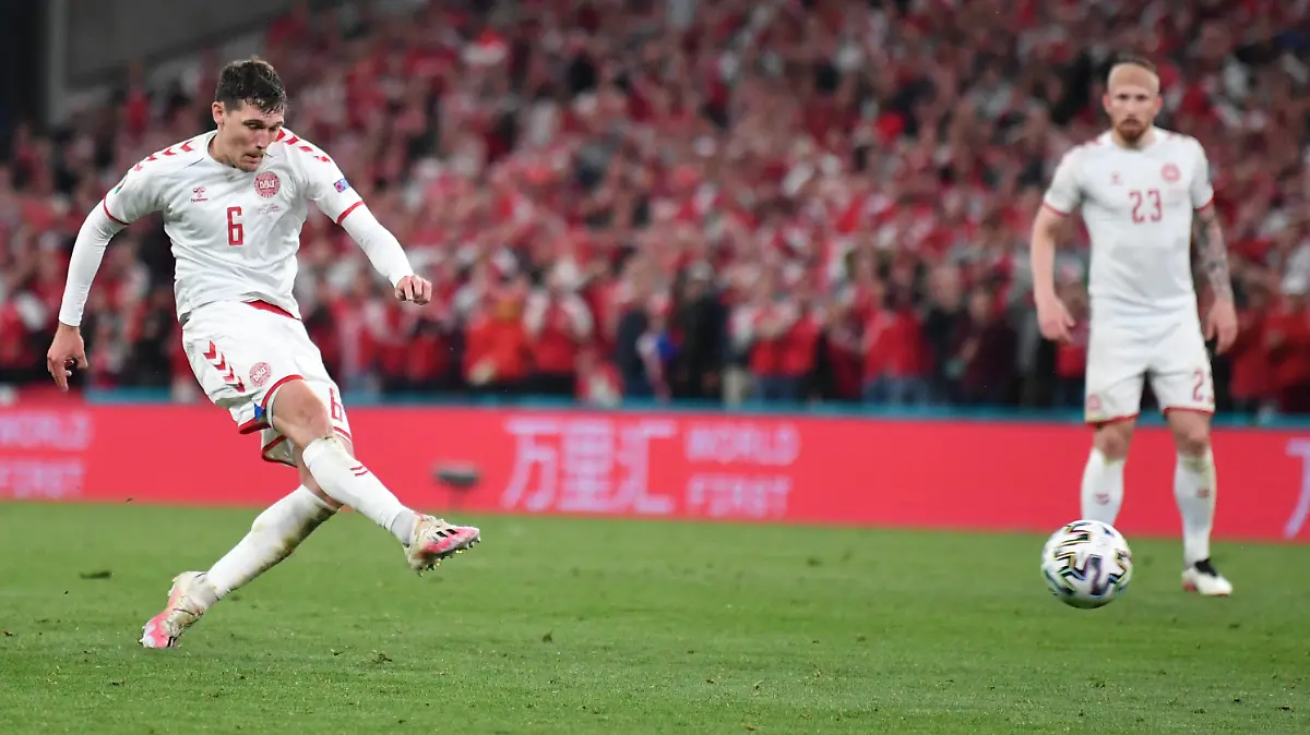 Denmark's Andreas Christensen scores his side's third goal during the Euro 2020 soccer championship group B match between Russia and Denmark at the Parken stadium in Copenhagen, Denmark, Monday, June 21, 2021. (Stuart Franklin/Pool via AP)