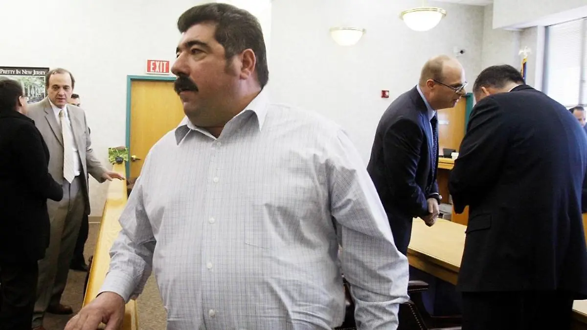 Americo Lopes exits the courtroom on Wednesday, March 14, 2012 in Elizabeth, N.J. A jury found that Lopes had cheated five co-workers out of their share of a $38.5 million lottery jackpot. The men worked at a construction company in Elizabeth and began a lottery pool in 2007. Americo Lopes claimed the winning numbers for the Nov. 10, 2009 jackpot were on a personal ticket and not the ticket that he had bought for the pool. The eight-member jury disagreed. (AP Photo/The Star-Ledger, Frances Micklow, Pool)