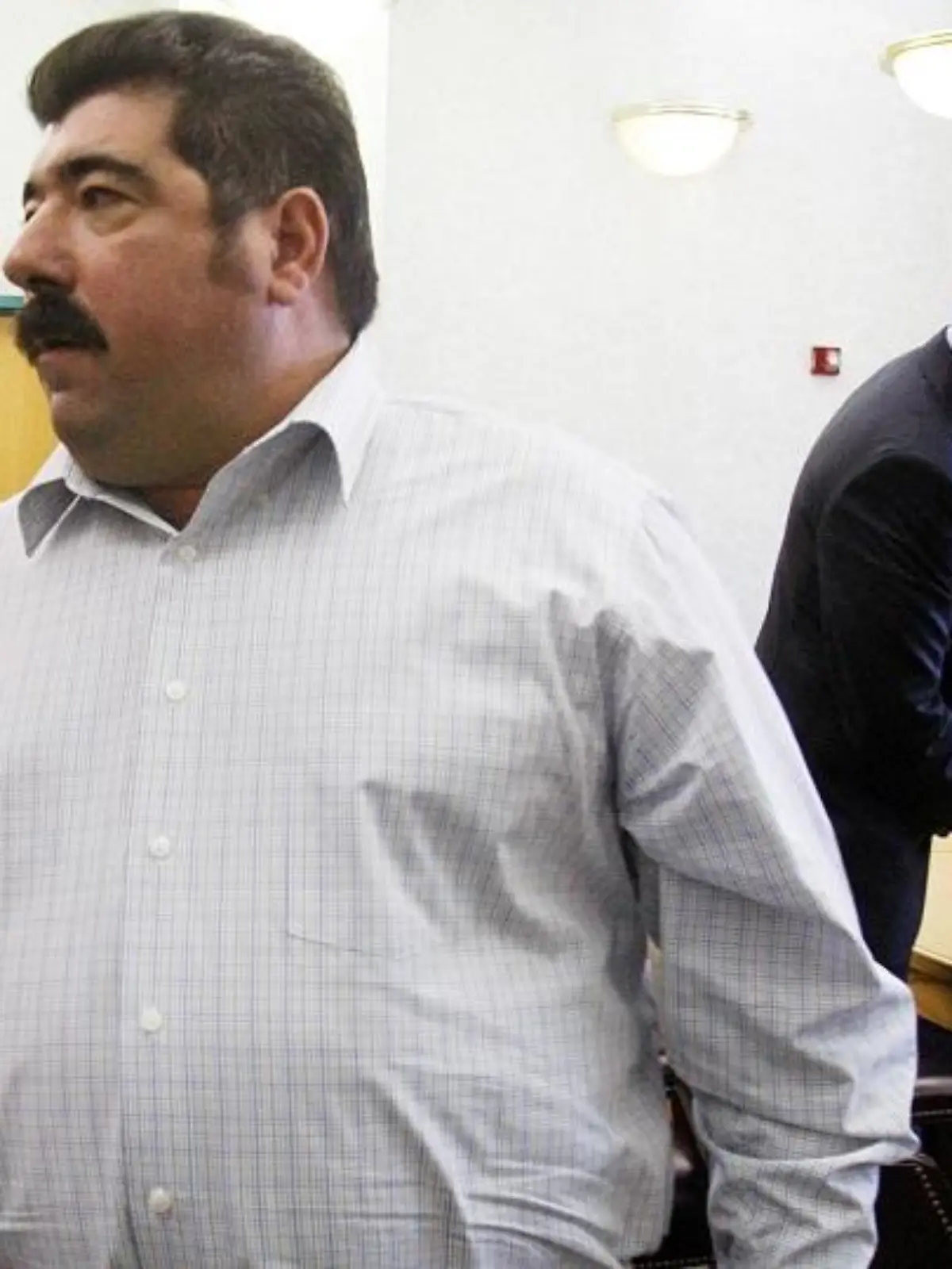 Americo Lopes exits the courtroom on Wednesday, March 14, 2012 in Elizabeth, N.J. A jury found that Lopes had cheated five co-workers out of their share of a $38.5 million lottery jackpot. The men worked at a construction company in Elizabeth and began a lottery pool in 2007. Americo Lopes claimed the winning numbers for the Nov. 10, 2009 jackpot were on a personal ticket and not the ticket that he had bought for the pool. The eight-member jury disagreed. (AP Photo/The Star-Ledger, Frances Micklow, Pool)
