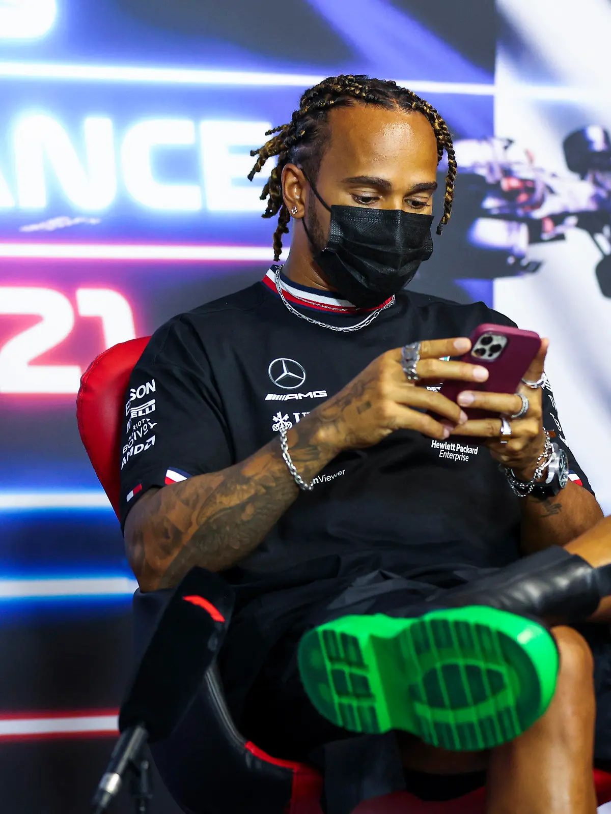 Mercedes driver Lewis Hamilton of Britain checks his smartphone as he attends a press conference ahead of the French Formula One Grand Prix at the Paul Ricard racetrack in Le Castellet, southern France, Thursday, June 17, 2021. The French Grand Prix will be held on Sunday. (Antonin Vincent, Pool via AP)