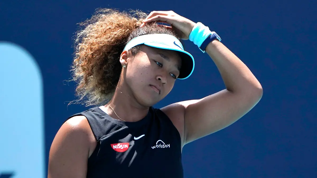 FILE - Naomi Osaka, of Japan, reacts during her match against Maria Sakkari, of Greece, in the quarterfinals of the Miami Open tennis tournament in Miami Gardens, Fla., in this Wednesday, March 31, 2021, file photo. Sakkari won 6-0, 6-4. Naomi Osaka withdrew from the French Open on Monday, May 31, 2021, and wrote on Twitter that she would be taking a break from competition, a dramatic turn of events for a four-time Grand Slam champion who said she experiences “huge waves of anxiety” before speaking to the media and revealed she has “suffered long bouts of depression.”(AP Photo/Lynne Sladky, File)