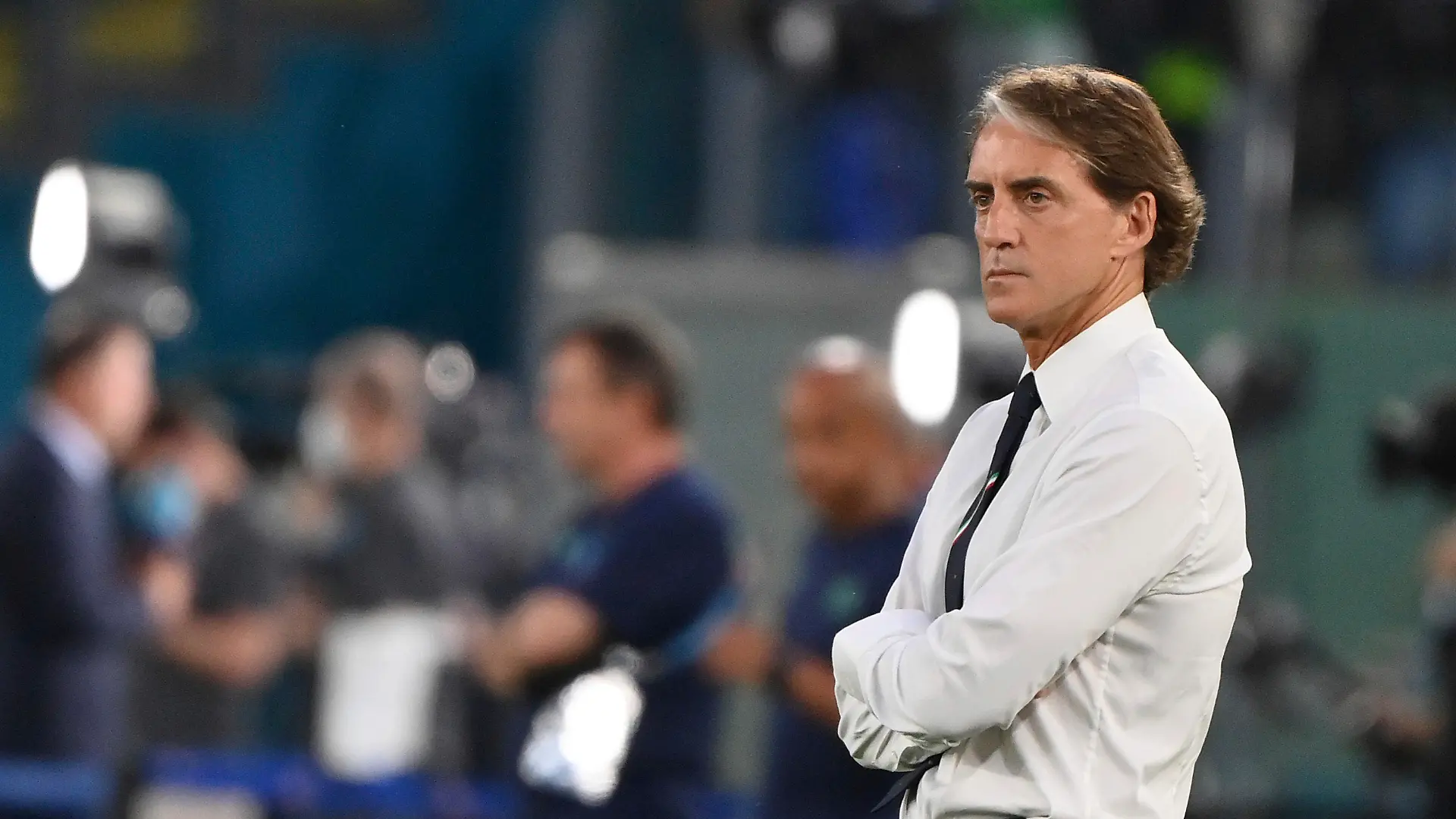 Italy coach Roberto Mancini stands on the pitch prior to the start of the Euro 2020 group A soccer match between Italy and Switzerland, in Rome's Olympic Stadium, Wednesday, June 16, 2021. (Alfredo Falcone/LaPresse via AP)