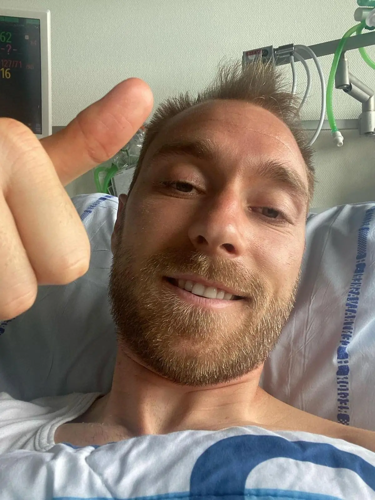 Danish footballer Christian Eriksen gives a thumbs-up at Rigshospitalet, where he is treated after he collapsed during a UEFA Euro 2020 game on Saturday, in Copenhagen, Denmark, in this picture obtained from social media. Picture published June 15, 2021. Danish Football Association/via REUTERS THIS IMAGE HAS BEEN SUPPLIED BY A THIRD PARTY. MANDATORY CREDIT. NO RESALES. NO ARCHIVES.