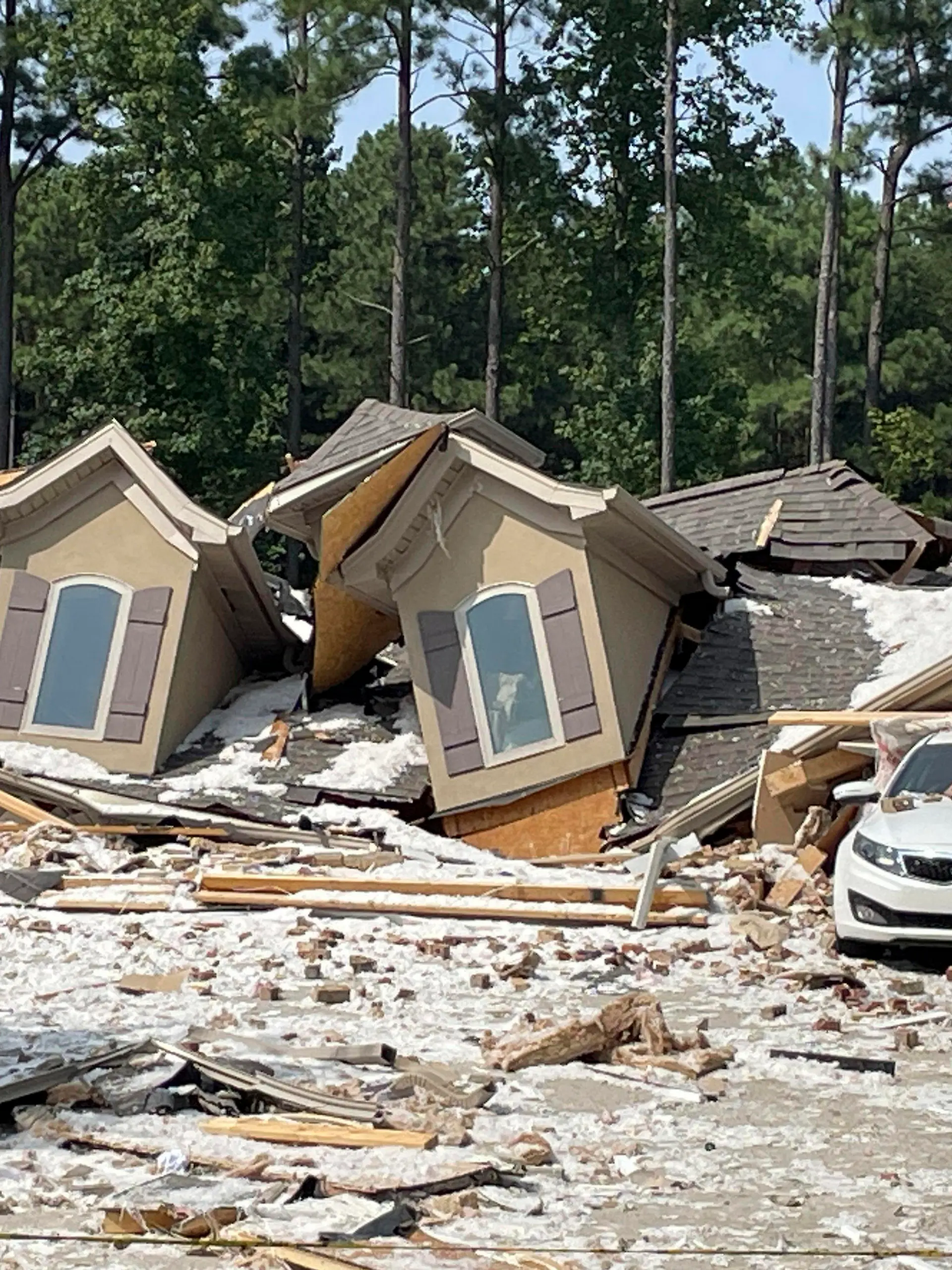 Damage and debris from a house explosion are seen in Mooresville, N.C., Tuesday, Aug. 22, 2023. Robert M. Farley, father of Tennessee Titans cornerback Caleb Farley, died overnight in the explosion that destroyed the NFL player's North Carolina home and left another person injured, authorities said. (AP Photo/Steve Reed)
