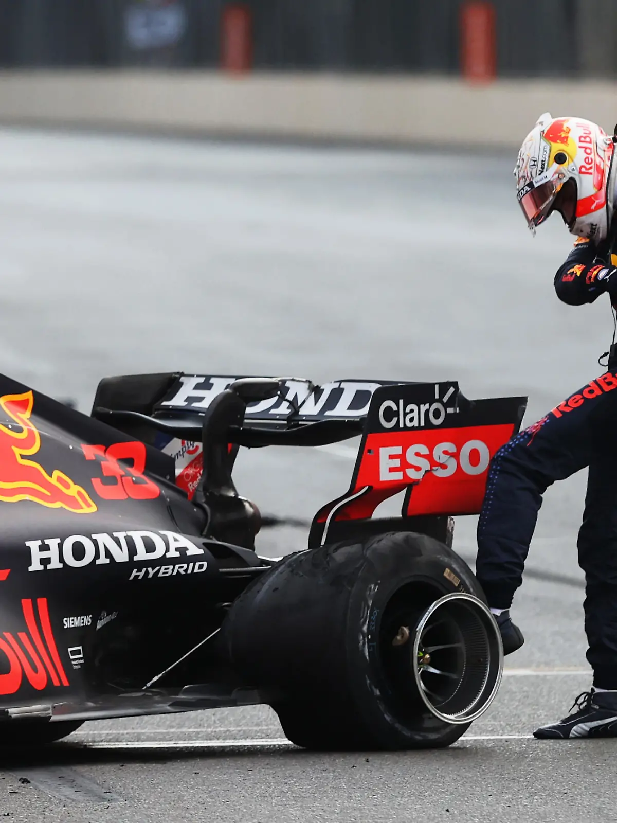 BAKU, AZERBAIJAN - JUNE 06:Max Verstappen of Netherlands and Red Bull Racing kicks his tyre as he reacts after crashing during the F1 Grand Prix of Azerbaijan at Baku City Circuit on June 06, 2021 in Baku, Azerbaijan. (Photo by Clive Rose/Getty Images)