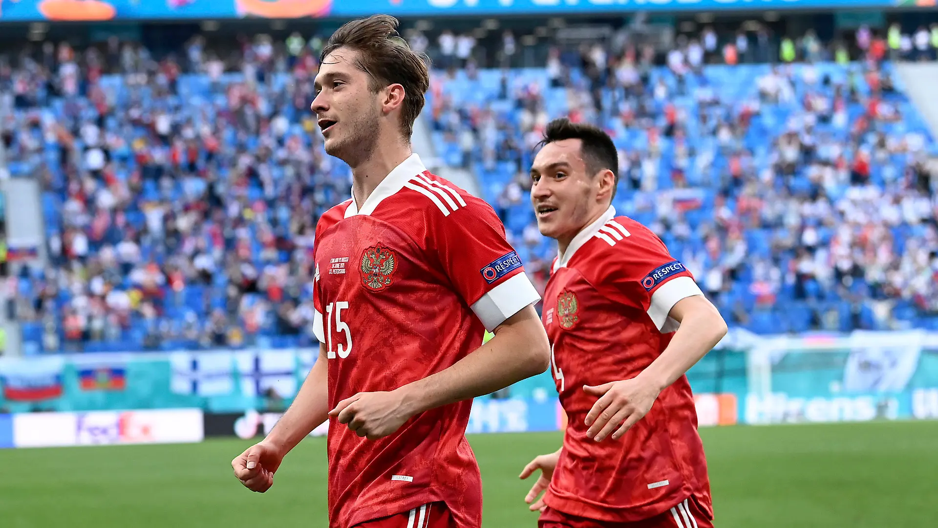 Russia's Aleksei Miranchuk, front, celebrates after scoring the opening goal during the Euro 2020 soccer championship group B match between Finland and Russia at the Gazprom Arena stadium in St. Petersburg, Russia, Wednesday, June 16, 2021. (AP Photo/Kirill Kudryavtsev, Pool)