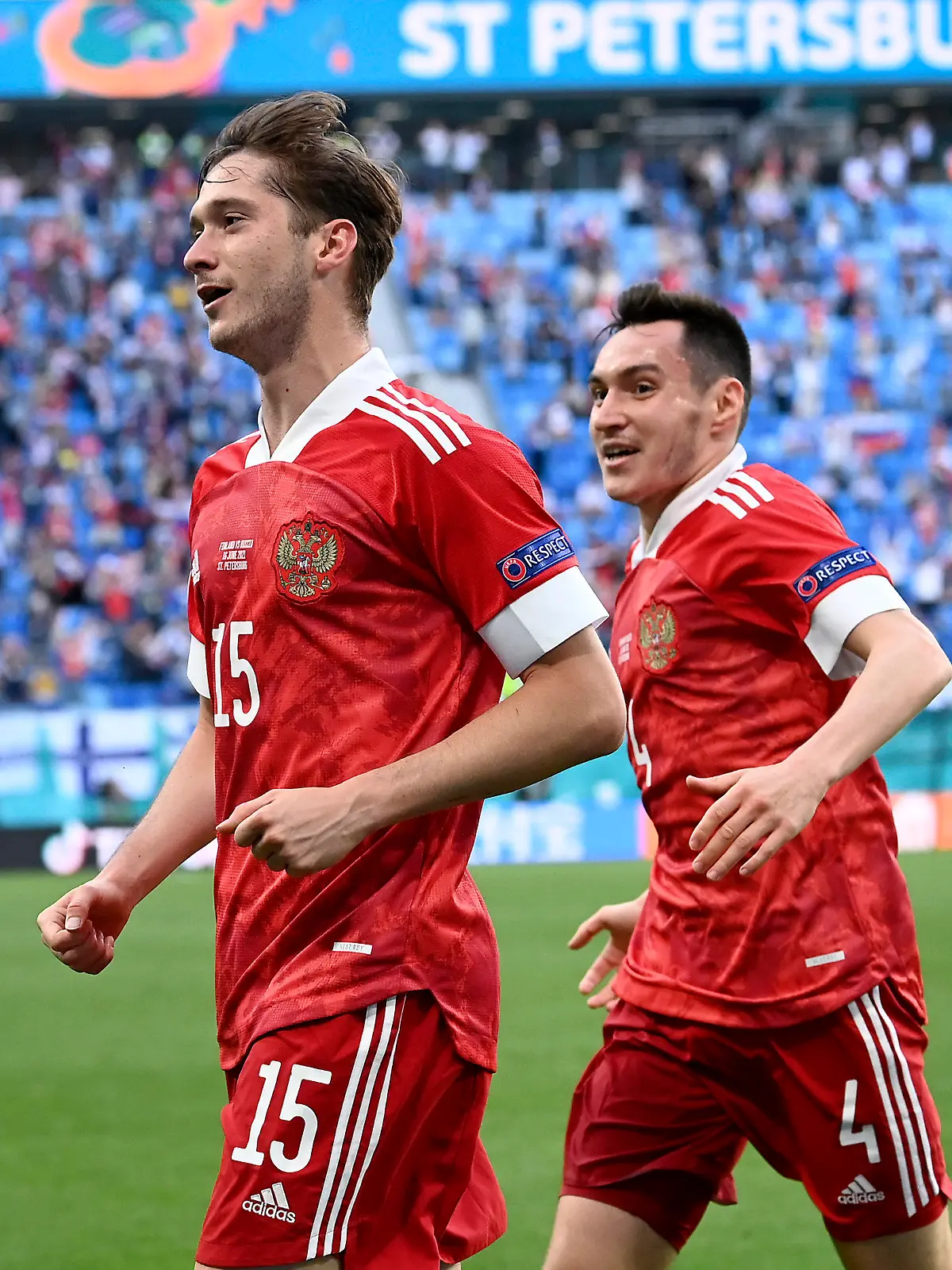 Russia's Aleksei Miranchuk, front, celebrates after scoring the opening goal during the Euro 2020 soccer championship group B match between Finland and Russia at the Gazprom Arena stadium in St. Petersburg, Russia, Wednesday, June 16, 2021. (AP Photo/Kirill Kudryavtsev, Pool)