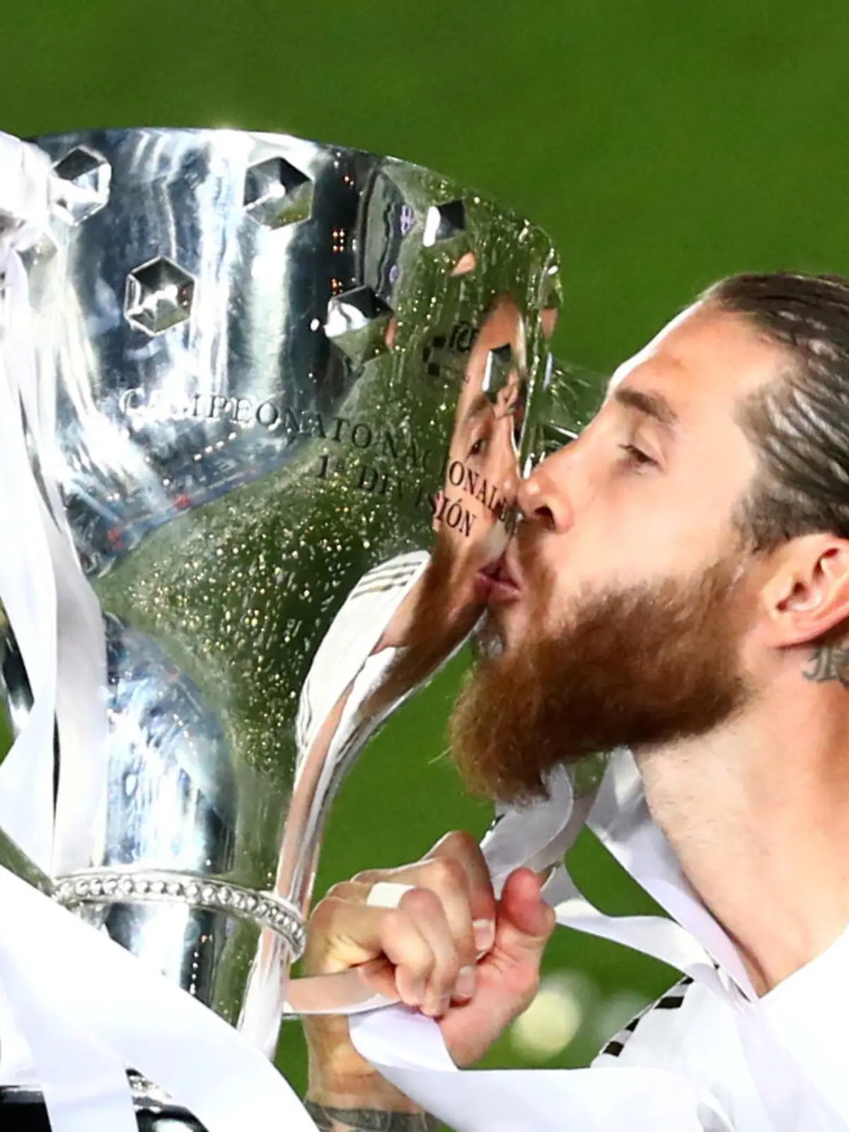 FILE PHOTO: Soccer Football - La Liga Santander - Real Madrid v Villarreal - Alfredo Di Stefano Stadium, Madrid, Spain - July 16, 2020   Real Madrid's Sergio Ramos celebrates with the trophy after winning La Liga, as play resumes behind closed doors following the outbreak of the coronavirus disease (COVID-19)   REUTERS/Sergio Perez/File Photo