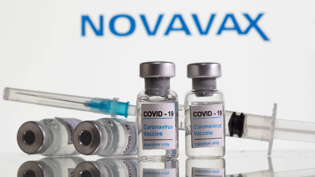 FILE PHOTO: Vials labelled "COVID-19 Coronavirus Vaccine" and syringe are seen in front of displayed Novavax logo in this illustration taken, February 9, 2021. REUTERS/Dado Ruvic/Illustration/File Photo