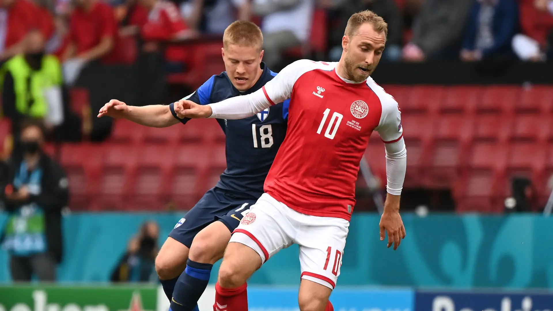 Soccer Football - Euro 2020 - Group B - Denmark v Finland - Parken Stadium, Copenhagen, Denmark - June 12, 2021 Denmark's Christian Eriksen in action with Finland's Jere Uronen Pool via REUTERS/Jonathan Nackstrand