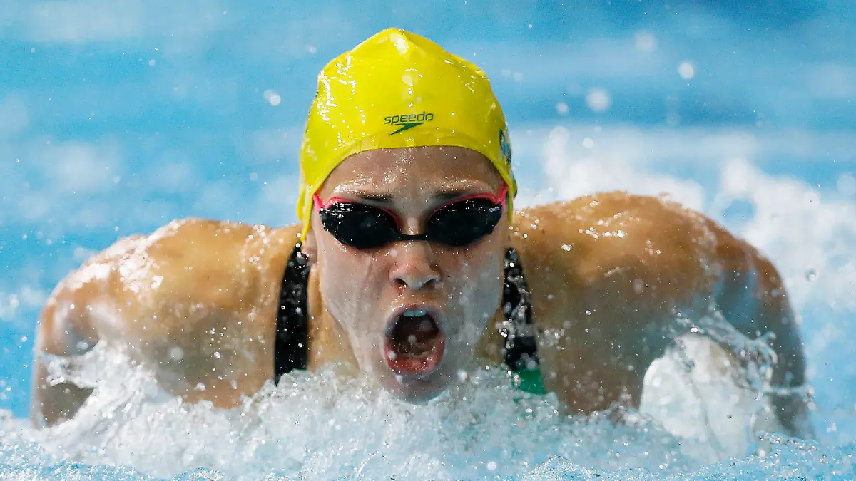 FILE - In this July 28, 2014, file photo, Maddie Groves of Australia swims to win silver in the Women's 200m Butterfly final at the Tollcross International Swimming Centre during the Commonwealth Games 2014 in Glasgow, Scotland. Cody Simpson was dominating attention ahead of Australia’s Olympic swimming trials, until Groves pulled out of the six-day meet following a series of social media posts condemning “misogynistic perverts” in the sport. (AP Photo/Kirsty Wigglesworth, File)
