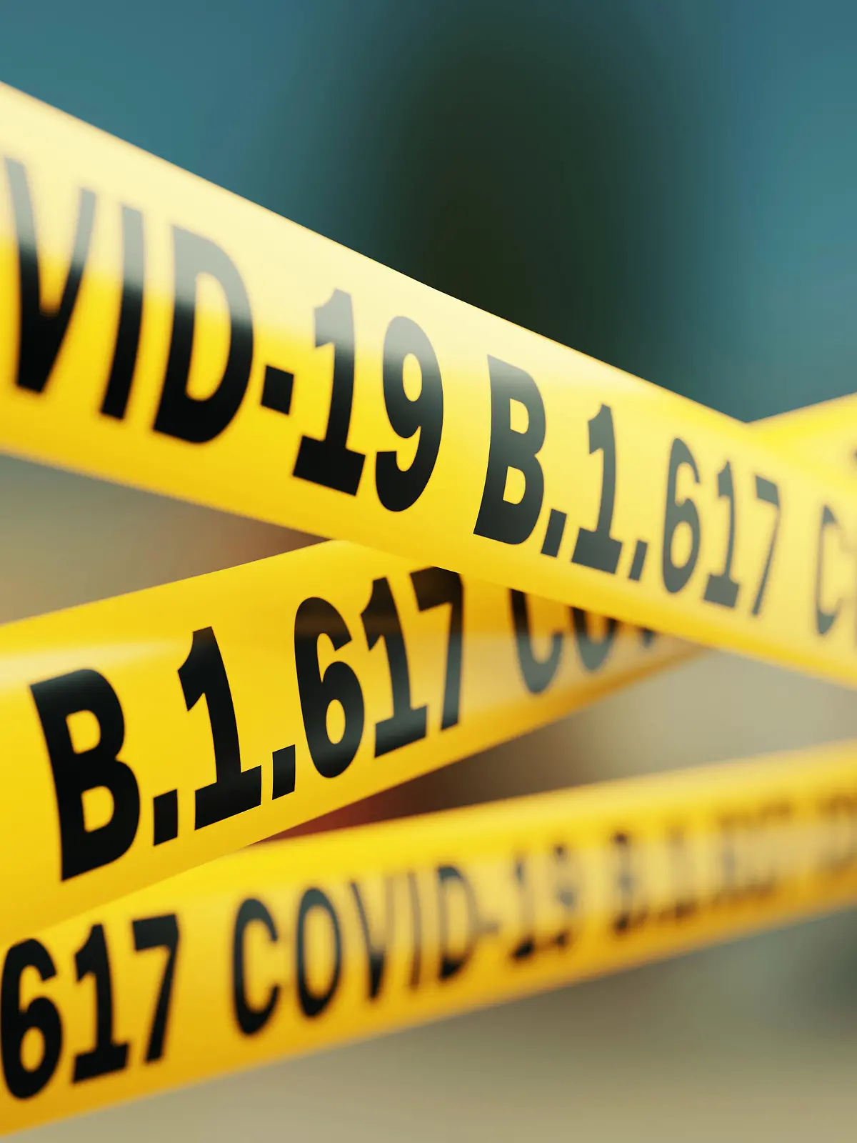 Absperrbänder beschriftet mit Covid-19 B1.6176