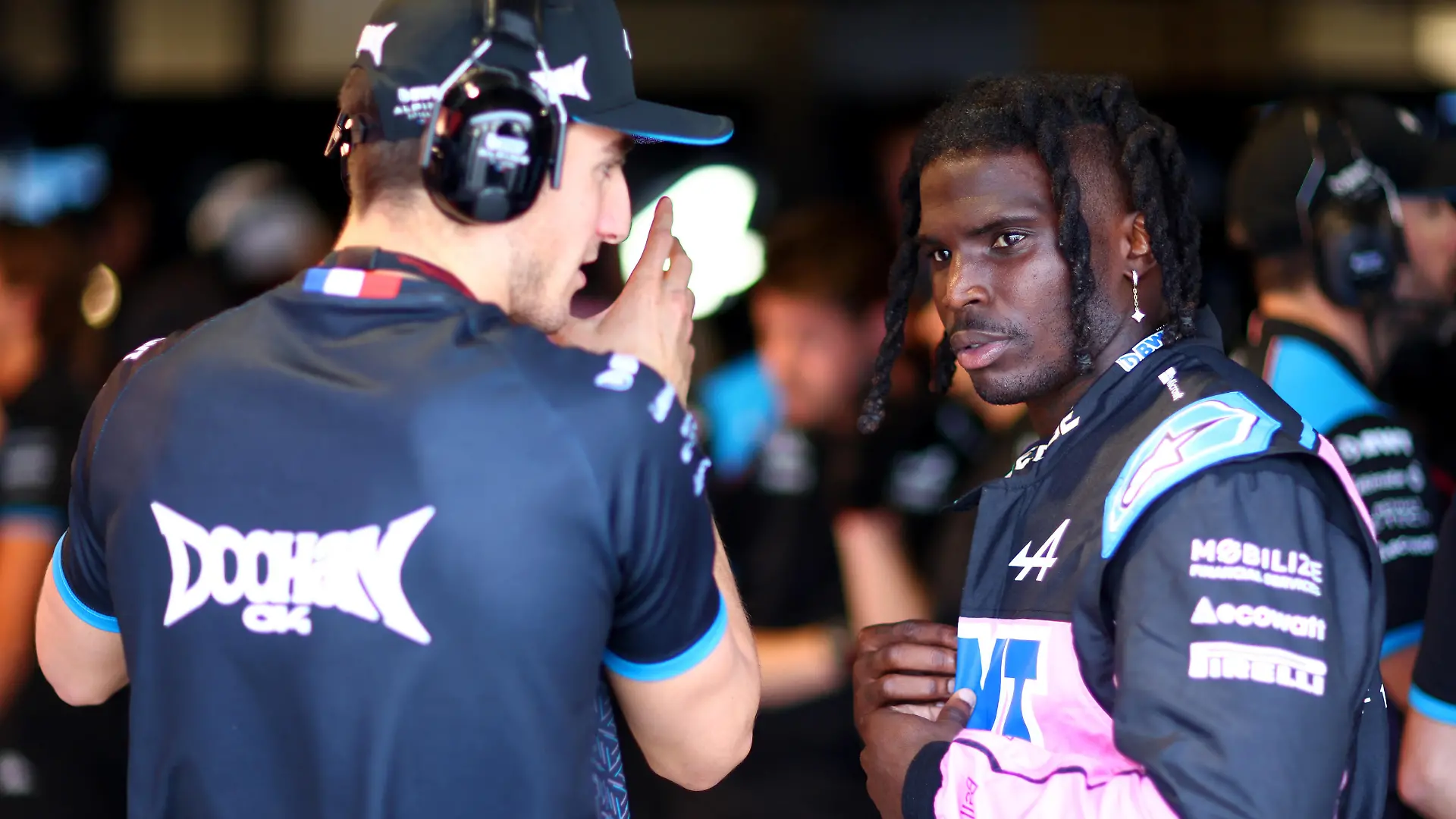 MIAMI, FLORIDA - MAY 05: Tyreek Hill of the Miami Dolphins speaks with Jack Doohan of Australia and Alpine F1 in the Alpine garage during practice ahead of the F1 Grand Prix of Miami at Miami International Autodrome on May 05, 2023 in Miami, Florida. (Photo by Dan Istitene - Formula 1/Formula 1 via Getty Images)