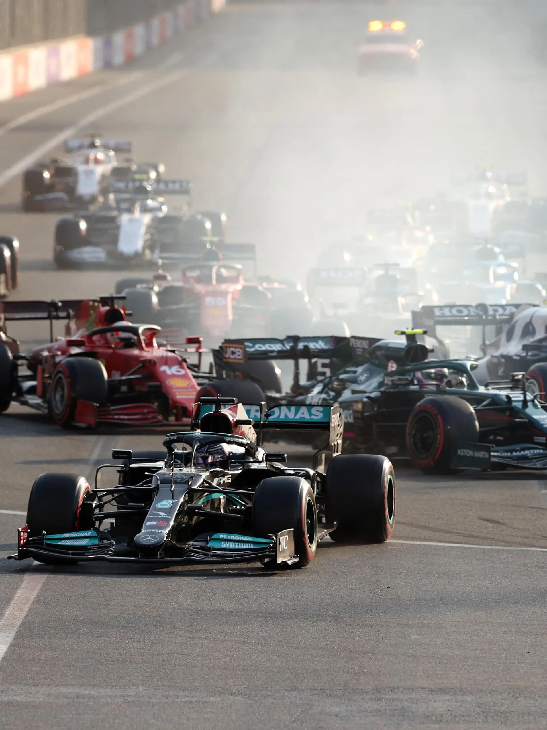 BAKU, AZERBAIJAN - JUNE 06: Lewis Hamilton of Great Britain driving the (44) Mercedes AMG Petronas F1 Team Mercedes W12 runs wide after locking up at the restart following a red flag period during the F1 Grand Prix of Azerbaijan at Baku City Circuit on June 06, 2021 in Baku, Azerbaijan. (Photo by Clive Rose/Getty Images)