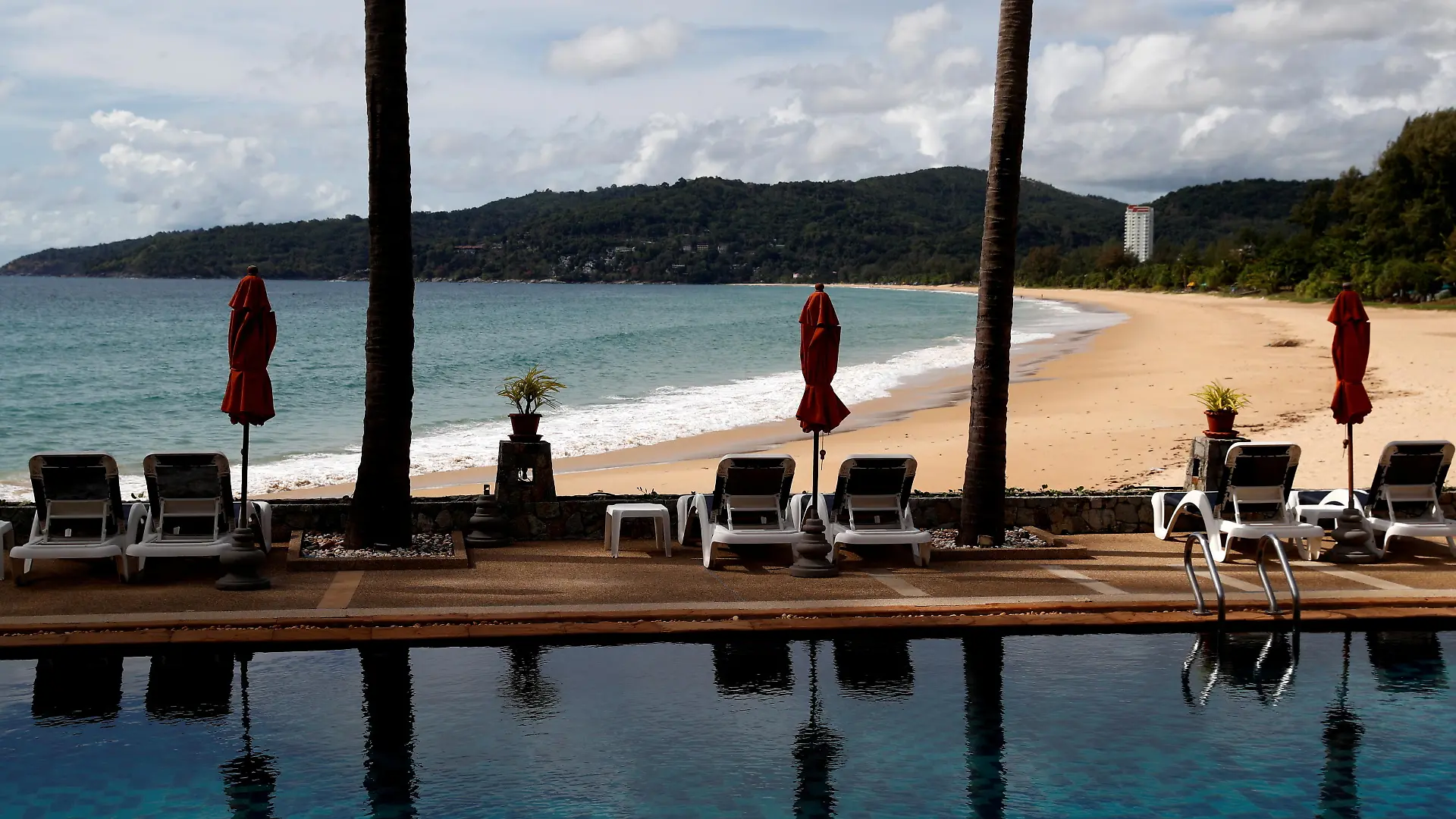 FILE PHOTO: An empty hotel and beach which have opened for visitors is seen in Karon, Phuket Island, Thailand March 31, 2021. Picture taken March 31, 2021. REUTERS/Jorge Silva/File Photo