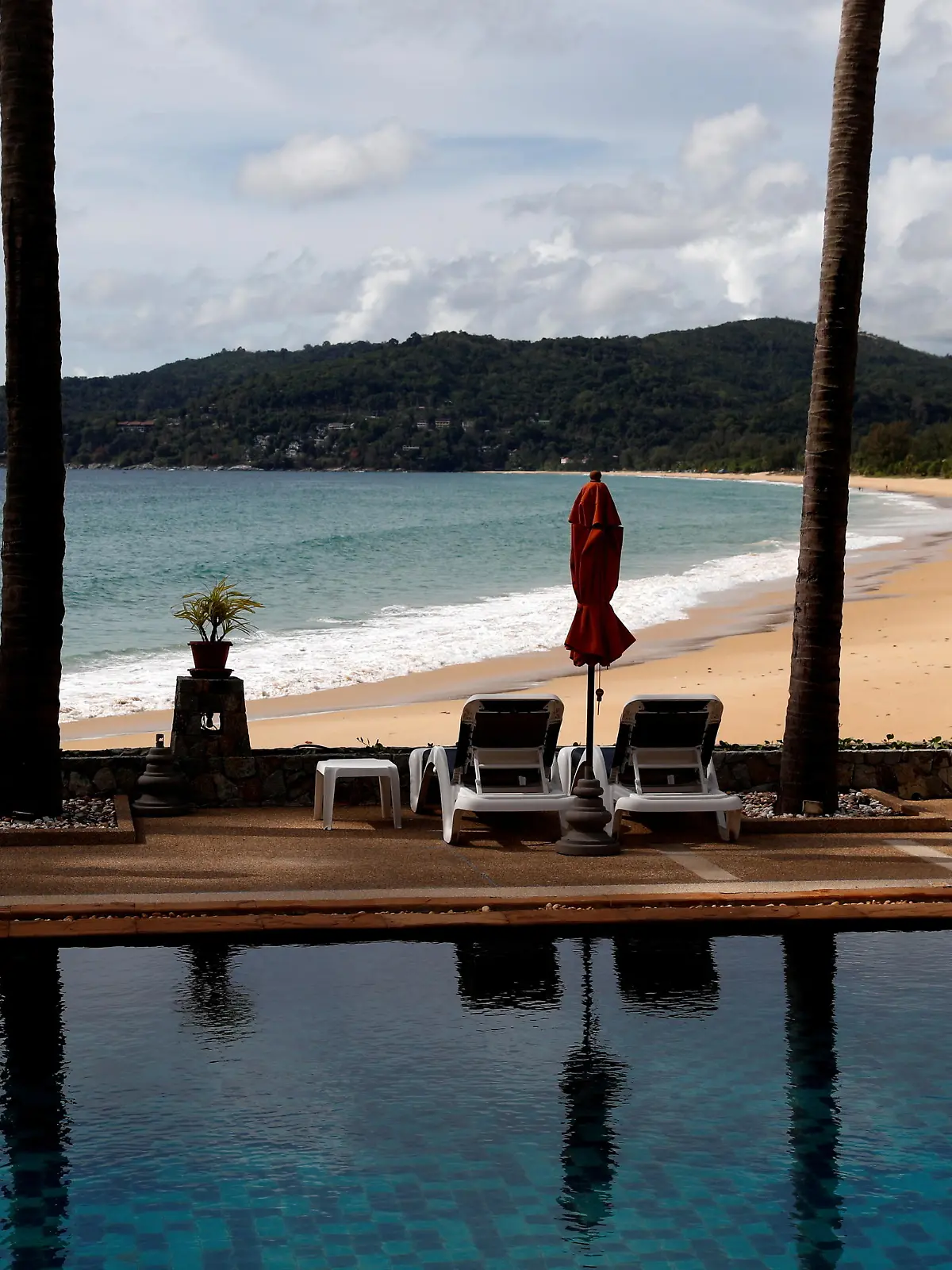 FILE PHOTO: An empty hotel and beach which have opened for visitors is seen in Karon, Phuket Island, Thailand March 31, 2021. Picture taken March 31, 2021. REUTERS/Jorge Silva/File Photo