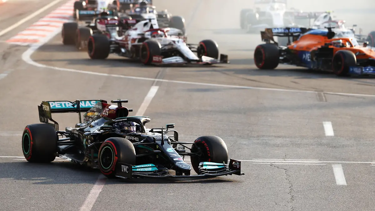 BAKU, AZERBAIJAN - JUNE 06: Lewis Hamilton of Great Britain driving the (44) Mercedes AMG Petronas F1 Team Mercedes W12 runs wide after locking up at the restart following a red flag period during the F1 Grand Prix of Azerbaijan at Baku City Circuit on June 06, 2021 in Baku, Azerbaijan. (Photo by Clive Rose/Getty Images)