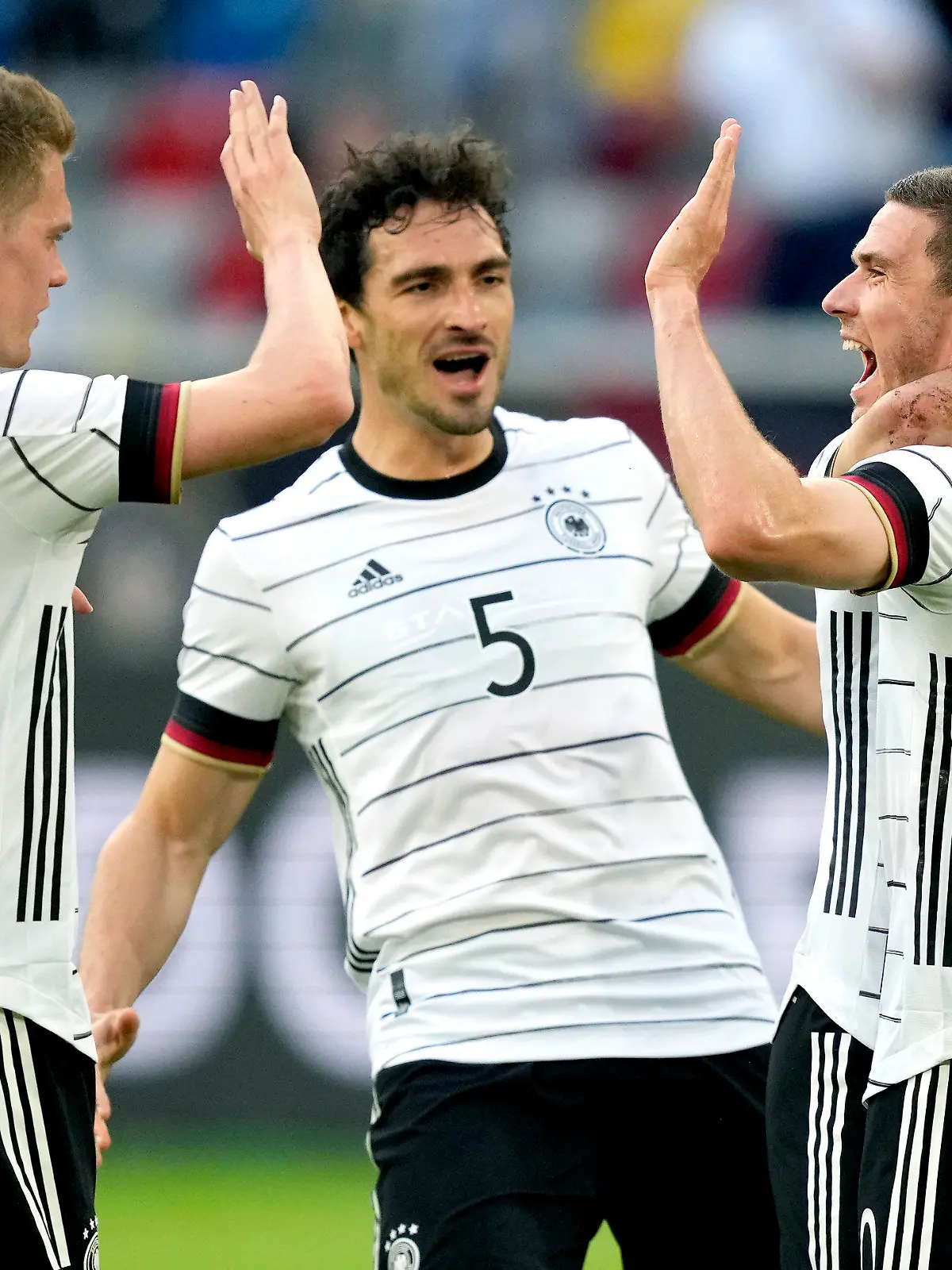 Germany's scorer Robin Gosens, front right, and his teammates celebrate the opening goal during the international friendly soccer match between Germany and Latvia in Duesseldorf, Germany, Monday, June 7, 2021. (AP Photo/Martin Meissner)