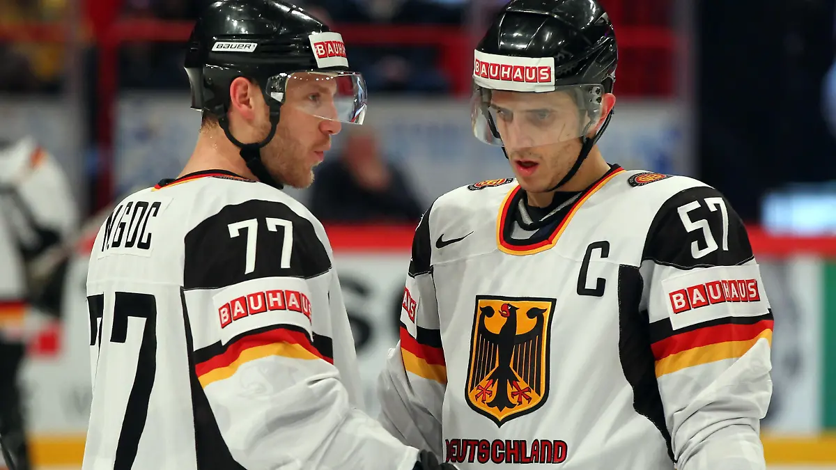 STOCKHOLM, SWEDEN - MAY 09: Nicolai Goc (L) of Germany talks to team mate Marcel Goc (R) during the IIHF World Championship group S match between Sweden and Germany at Ericsson Globe on May 9, 2012 in Stockholm, Sweden. (Photo by Martin Rose/Bongarts/Getty Images)