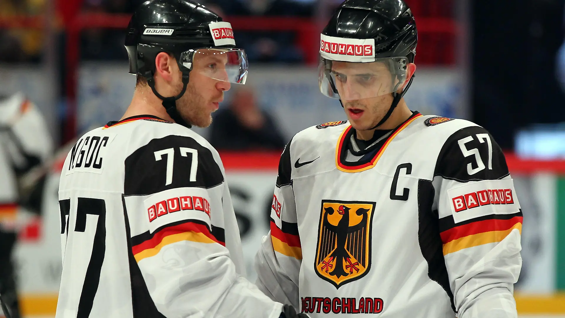 STOCKHOLM, SWEDEN - MAY 09: Nicolai Goc (L) of Germany talks to team mate Marcel Goc (R) during the IIHF World Championship group S match between Sweden and Germany at Ericsson Globe on May 9, 2012 in Stockholm, Sweden. (Photo by Martin Rose/Bongarts/Getty Images)
