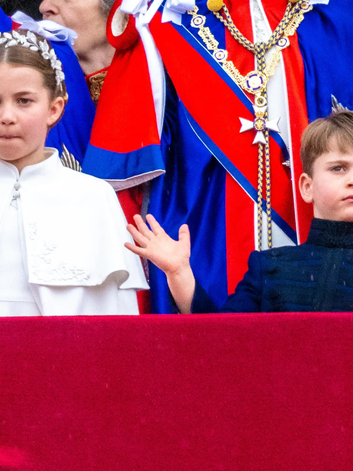 Prince Louis, Princess Charlotte during appearance on the Buckingham Palace balcony to watch the flypast after the procession and the coronation of the new King and Queen at Westminster Abbey in London, UK.