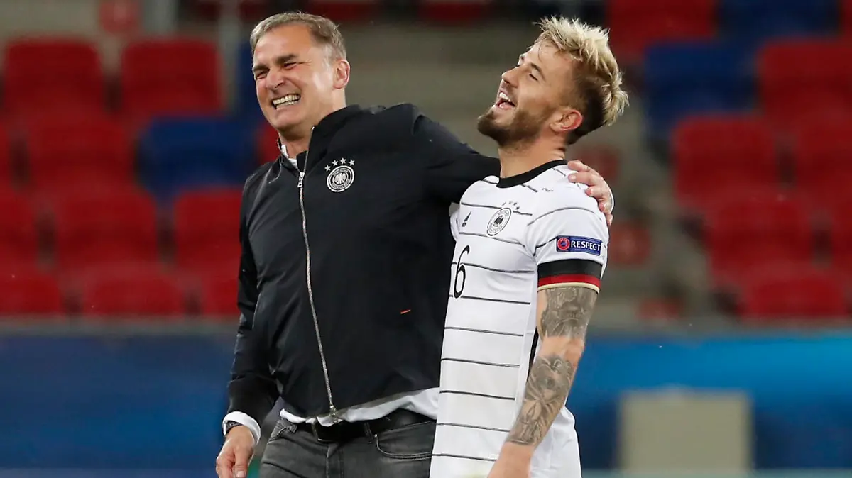 Soccer Football - UEFA Under 21 Championship - Semi Final - Netherlands v Germany - MOL Arena Sosto, Szekesfehervar, Hungary - June 3, 2021 Germany's Niklas Dorsch celebrates with coach Stefan Kuntz after the match REUTERS/Bernadett Szabo