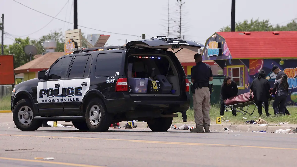 Emergency personnel respond to a fatal collision in Brownsville, Texas, on Sunday, May 7, 2023. Several migrants were killed after they were struck by a vehicle while waiting at a bus stop near Ozanam Center, a migrant and homeless shelter. (AP Photo/Michael Gonzalez)