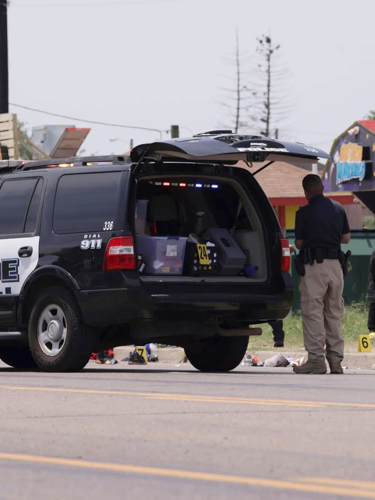 Emergency personnel respond to a fatal collision in Brownsville, Texas, on Sunday, May 7, 2023. Several migrants were killed after they were struck by a vehicle while waiting at a bus stop near Ozanam Center, a migrant and homeless shelter. (AP Photo/Michael Gonzalez)