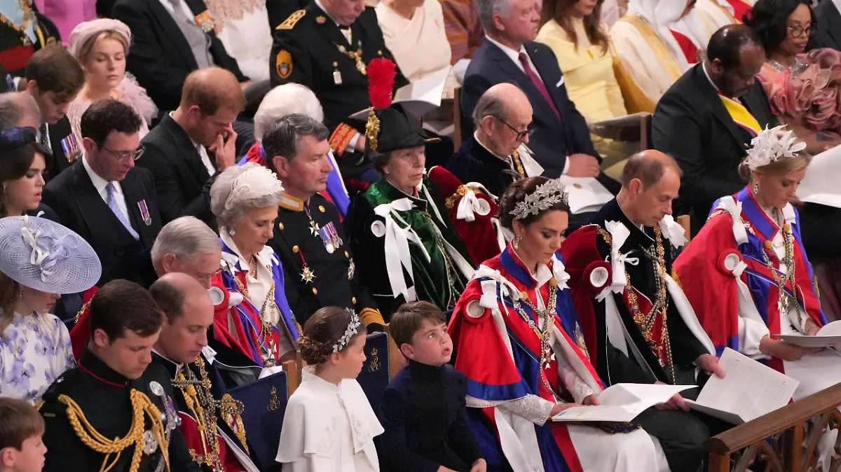 Front row, third left to right, Prince William, Princess Charlotte, Prince Louis, Kate, Princess of Wales, Prince Edward and Sophie, Duchess of Edinburgh, and Prince Harry, third row right, attend the coronation ceremony of Britain's King Charles III in Westminster Abbey, London, Saturday, May 6, 2023. (Aaron Chown/Pool Photo via AP)
