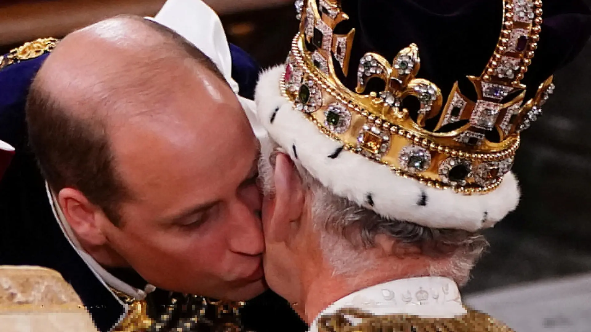 The Prince of Wales kisses his father King Charles III during his coronation ceremony in Westminster Abbey, London. Picture date: Saturday May 6, 2023.    Yui Mok/Pool via REUTERS