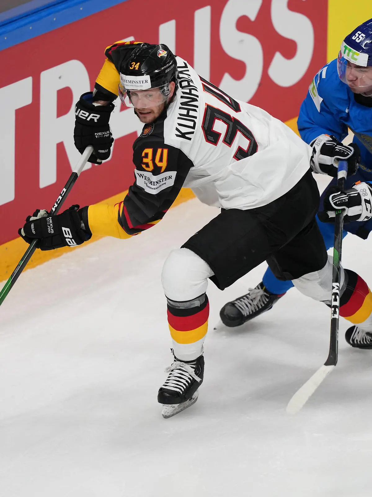 26.05.2021, Riga, Arena Riga, Kazakhstan vs Germany 2021 IIHF Ice hockey, Eishockey World Championship, WM, Weltmeisterschaft , 34 Tom Kuhnhackl Germany protect the puck from 55 Ivan Stepanenko Kazakhstan Riga Riga Latvia *** 26 05 2021, Riga, Arena Riga, Kazakhstan vs Germany 2021 IIHF Ice Hockey World Championship , 34 Tom Kuhnhackl Germany protect the puck from 55 Ivan Stepanenko Kazakhstan Riga Latvia PUBLICATIONxNOTxINxSUI Copyright: xJustPictures.ch/JarixPestelaccix 