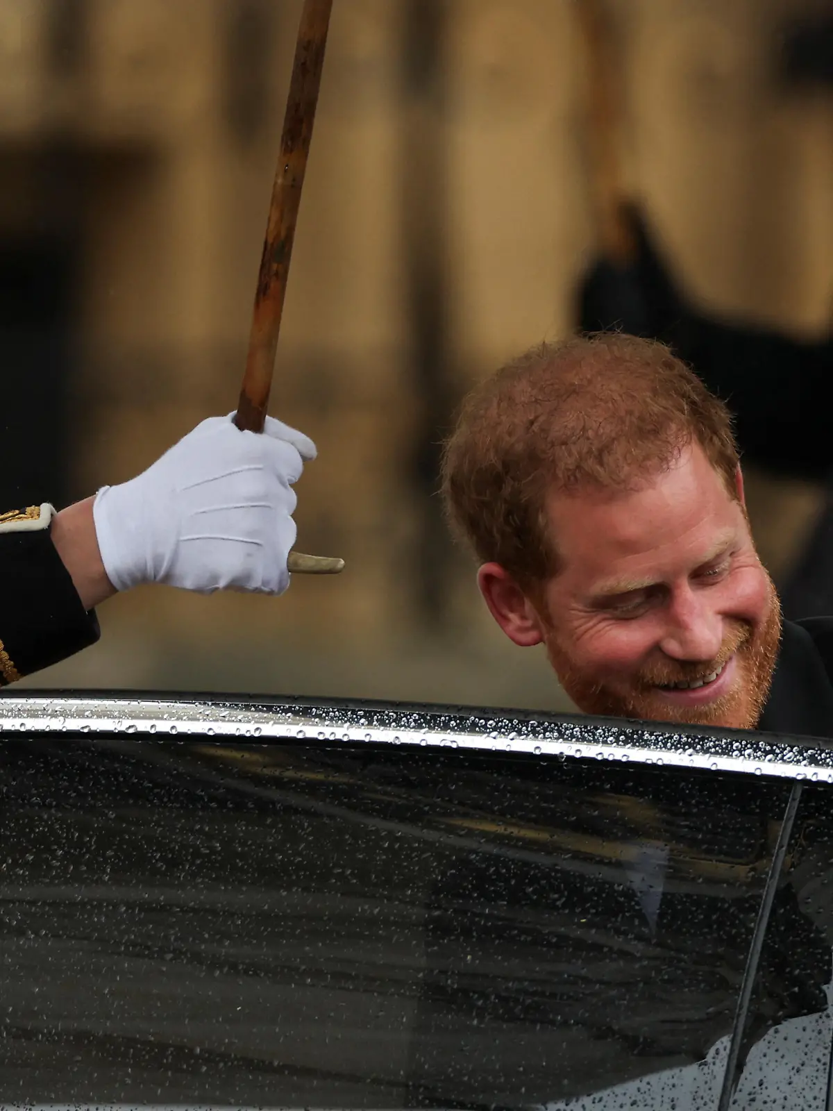 Britain's Prince Harry enters a car outside Westminster Abbey following Britain's King Charles' coronation ceremony, in London, Britain May 6, 2023. REUTERS/Henry Nicholls
