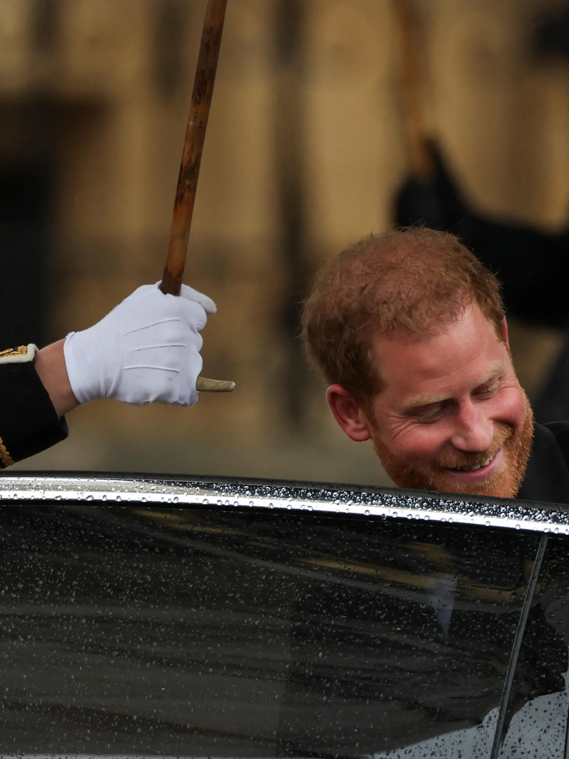 Britain's Prince Harry enters a car outside Westminster Abbey following Britain's King Charles' coronation ceremony, in London, Britain May 6, 2023. REUTERS/Henry Nicholls