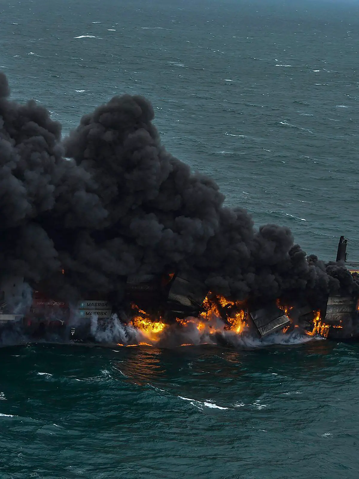In this photo provided by Sri Lanka Air Force, smoke rises from the container vessel MV X-Press Pearl engulfed in flames off Colombo port, Sri Lanka, Tuesday, May 25, 2021. An explosion occurred Tuesday on a ship anchored off Sri Lanka's capital on which a fire had been burning for several days, prompting the evacuation of all crew members, officials said. (Sri Lanka Air Force via AP)