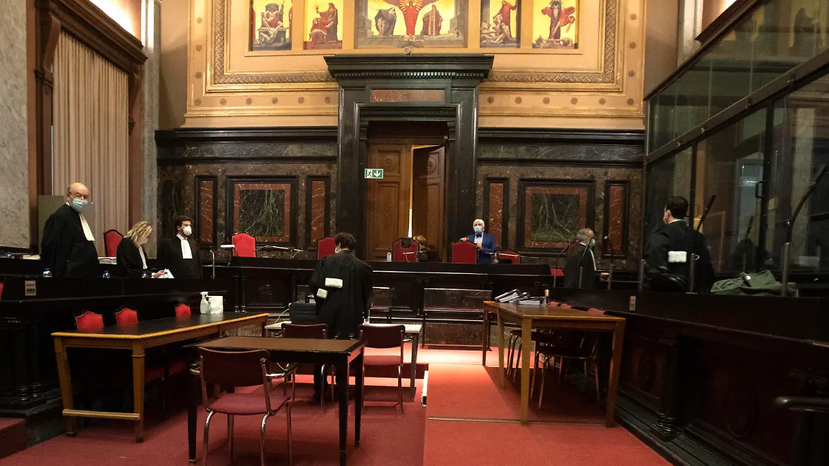 Lawyers for the European Commission, left, and AstraZeneca right, prepare arguments during a hearing, European Commission vs AstraZeneca, at the main courthouse in Brussels, Wednesday, May 26, 2021. While the EU insists AstraZeneca has breached its contractual obligations, the company says it has fully complied with the agreement, arguing that vaccines are difficult to manufacture and it made its best effort to deliver on time. the European Union's executive branch will try to persuade a Brussels court Wednesday that the case is urgent enough to justify ordering the company to make an immediate delivery of the missing shots. (AP Photo/Virginia Mayo)