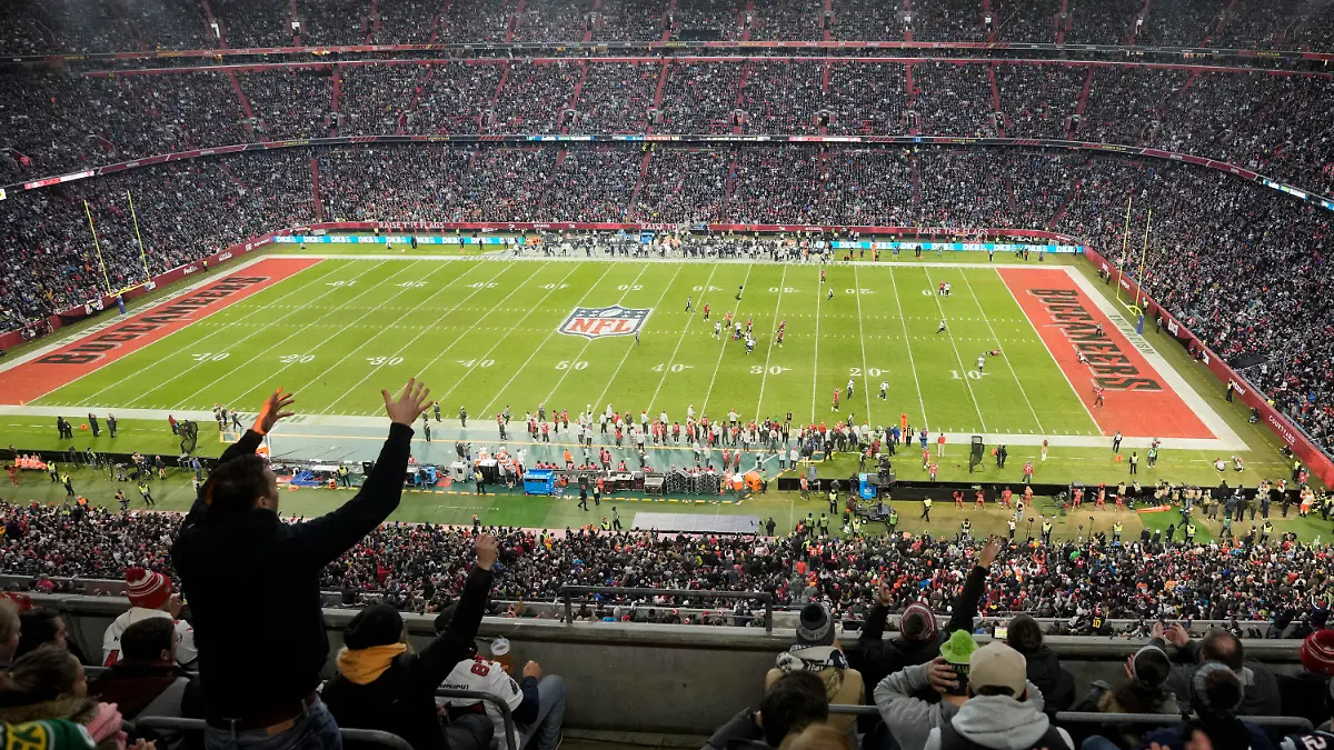 FILE - A fan reacts during a NFL match between Tampa Bay Buccaneers and Seattle Seahawks at the Allianz Arena in Munich, Germany, on Nov. 13, 2022. The NFL's inaugural regular season game in Germany created an economic impact of 70.2 million euros ($77.6 million) for host city Munich, the league said Wednesday May 3, 2023. (AP Photo/Matthias Schrader, File)