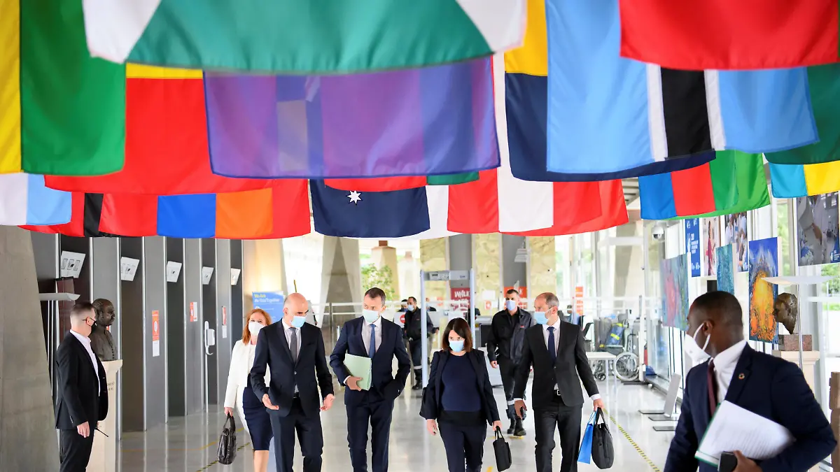 Swiss Interior and Health Minister Alain Berset walks with Swiss ambassador and Permanent Representative of Switzerland to the United Nations, Juerg Lauber, and Swiss Ambassador Nora Kronig Romero, Head of International Affairs Division and Vice Director of the Federal Office of Public Health, before speaking at the opening of the 74th World Health Assembly at the WHO headquarters, in Geneva, Switzerland May 24, 2021. Laurent Gillieron/Pool via REUTERS