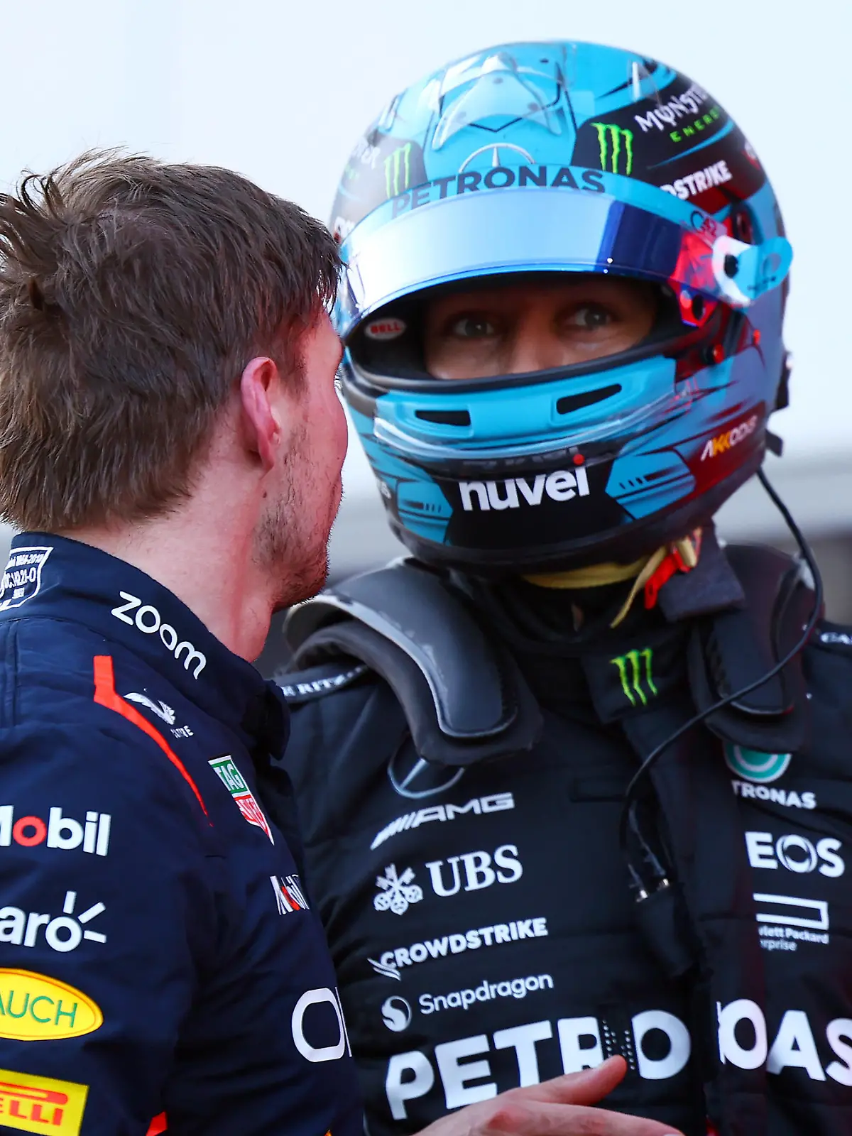 BAKU, AZERBAIJAN - APRIL 29: Third placed Max Verstappen of the Netherlands and Oracle Red Bull Racing and 4th placed George Russell of Great Britain and Mercedes talk in parc ferme during the Sprint ahead of the F1 Grand Prix of Azerbaijan at Baku City Circuit on April 29, 2023 in Baku, Azerbaijan. (Photo by Mark Thompson/Getty Images)