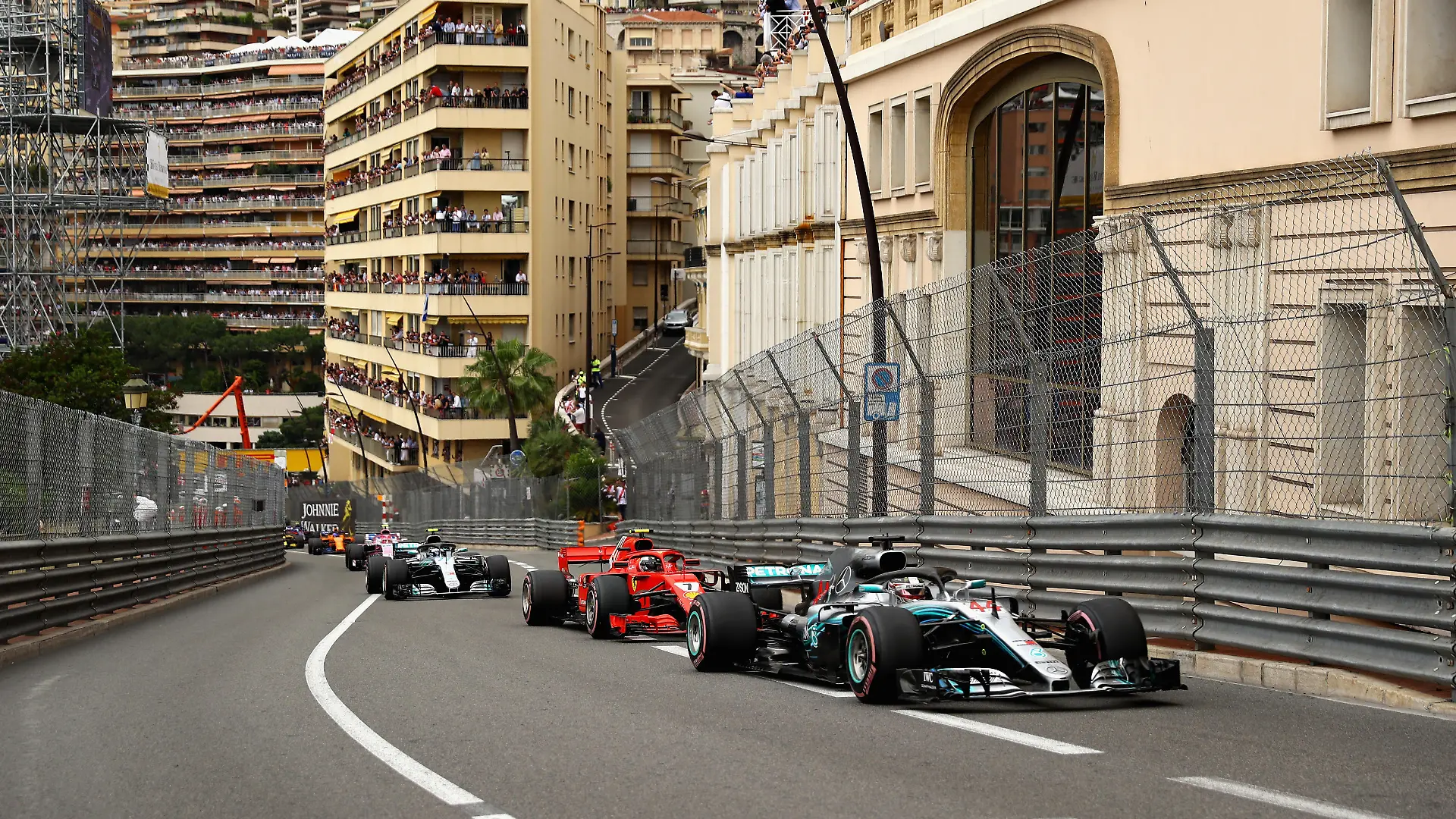 MONTE-CARLO, MONACO - MAY 27: Lewis Hamilton of Great Britain driving the (44) Mercedes AMG Petronas F1 Team Mercedes WO9 leads Kimi Raikkonen of Finland driving the (7) Scuderia Ferrari SF71H on track during the Monaco Formula One Grand Prix at Circuit de Monaco on May 27, 2018 in Monte-Carlo, Monaco. (Photo by Dan Istitene/Getty Images)