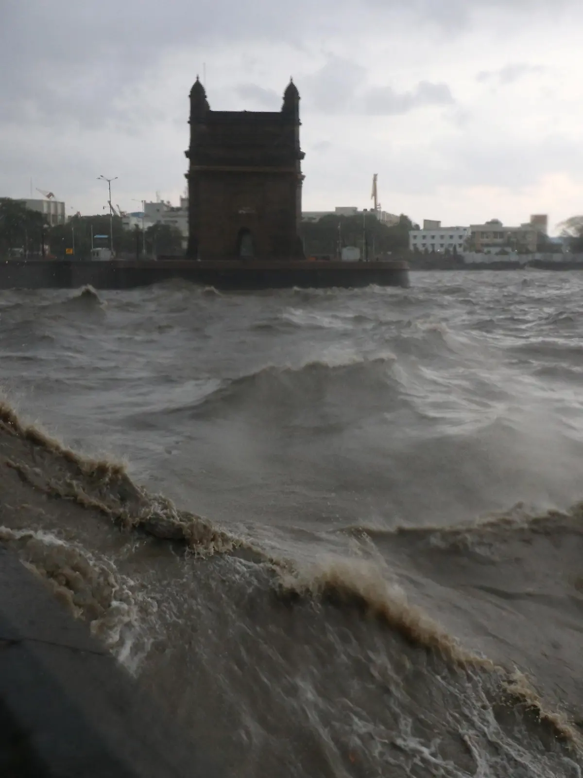 Waves caused by Cyclone Tauktae crash up on the promenade near the Gateway of India monument in Mumbai, India, May 17, 2021. REUTERS/Niharika Kulkarni