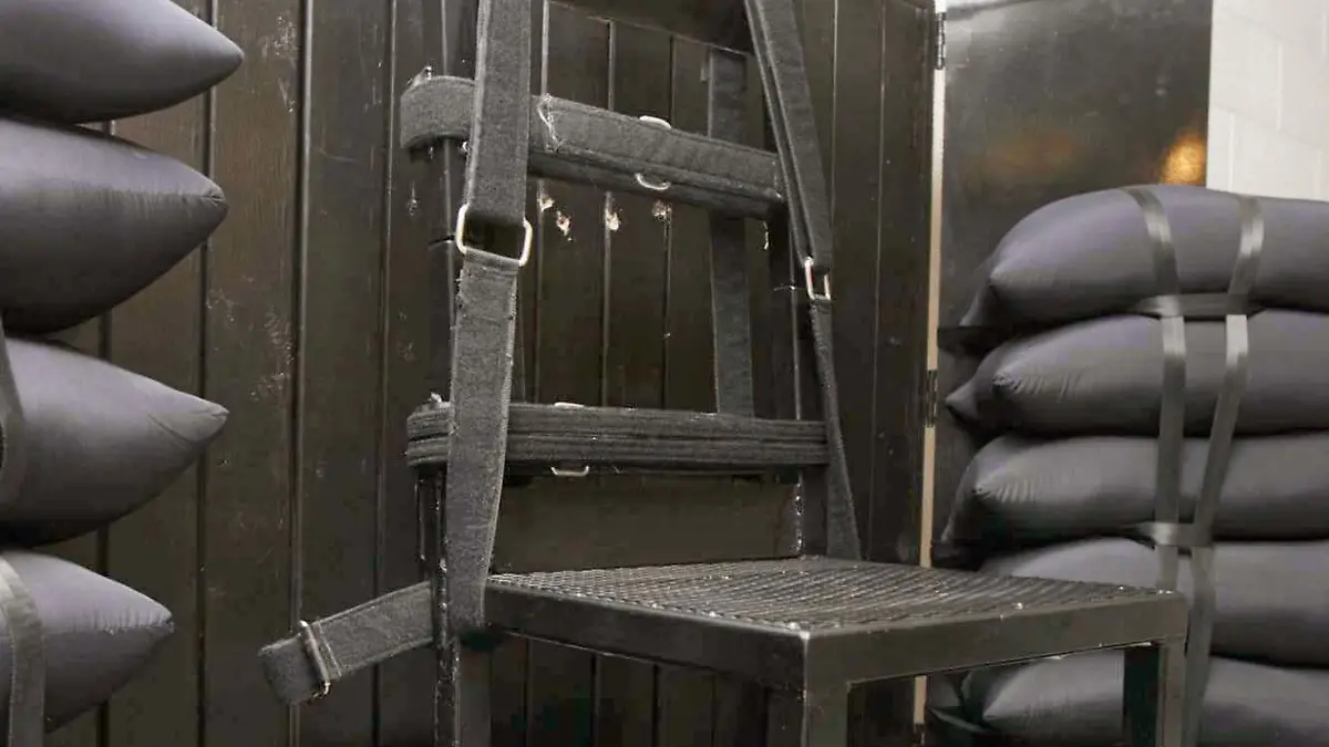 The execution chamber at the Utah State Prison after Ronnie Lee Gardner was executed by firing squad in Drape, Utah, USA, on 18 June 2010. Four bullet holes are visible in the wood panel behind the chair. Gardner, convicted of aggravated murder, a capital felony, in 1985, was executed by firing squad on 18 June, becoming just the third person to be put to death this way in more than three decades. EPA/TRENT NELSON / POOL