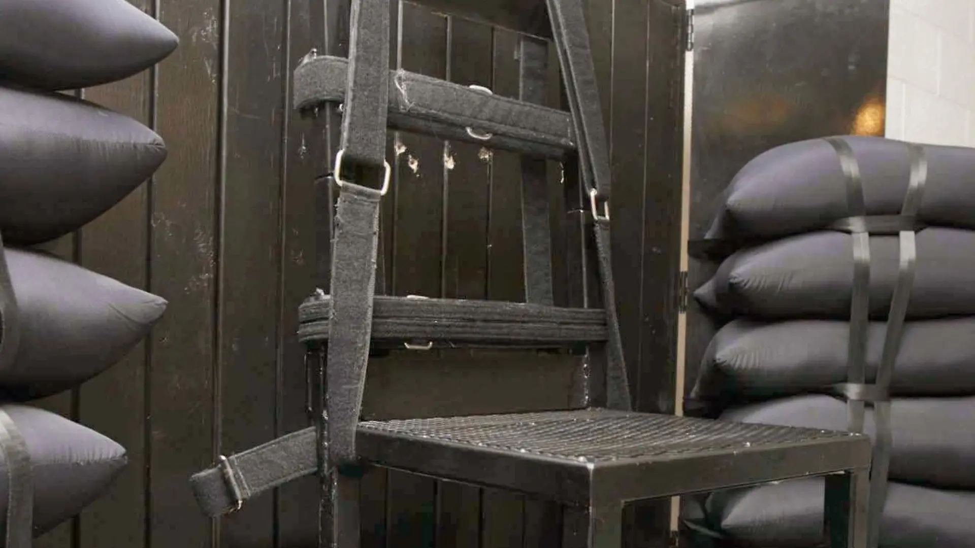 The execution chamber at the Utah State Prison after Ronnie Lee Gardner was executed by firing squad in Drape, Utah, USA, on 18 June 2010. Four bullet holes are visible in the wood panel behind the chair. Gardner, convicted of aggravated murder, a capital felony, in 1985, was executed by firing squad on 18 June, becoming just the third person to be put to death this way in more than three decades. EPA/TRENT NELSON / POOL