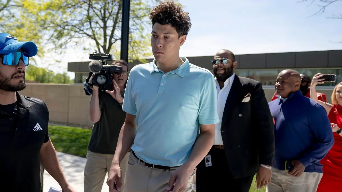 Jackson Mahomes, center, exits the Johnson County jail after being arraigned on three charges of sexual battery on Wednesday, May 3, 2023, in Olathe, Kan. (Nick Wagner/The Kansas City Star via AP)