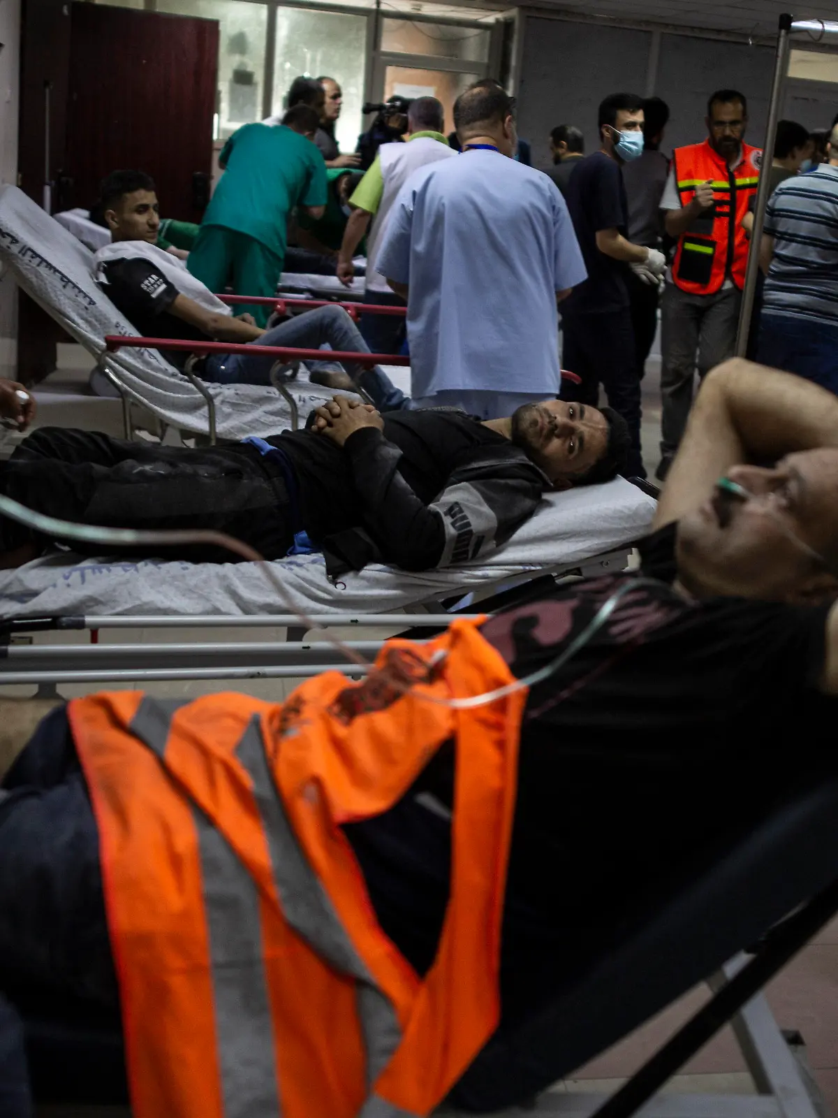 Palestinians receive treatment at the Shifa Hospital from their wounds caused by an Israeli airstrike that destroyed the upper floors of a commercial building and caused damage to the nearby Health Ministry and prime health care clinic, in Gaza City, Monday, May 17, 2021. (AP Photo/Khalil Hamra)