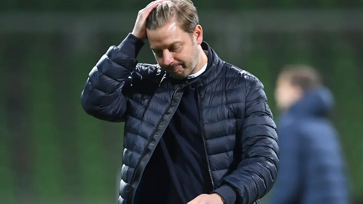 FILE-In this May 1, 2021 taken photo Bremen's head coach Florian Kohfeldt walks in dejection end of the German soccer cup semifinal soccer match between Werder Bremen and RB Leipzig at the Weserstadion stadium in Bremen, Germany. Werder Bremen has fired coach Florian Kohfeldt one match day before the end of the season. Former coach Thomas Schaaf will coach the team until the end of the season.(Carmen Jaspersen/Pool Photo via AP)