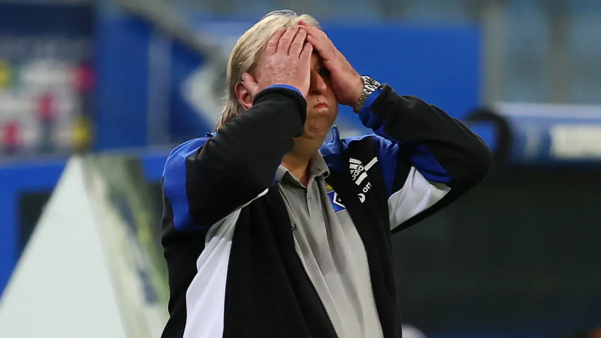 HAMBURG, GERMANY - MAY 10: Horst Hrubesch, Head Coach of Hamburger SV reacts during the Second Bundesliga match between Hamburger SV and 1. FC Nürnberg at Volksparkstadion on May 10, 2021 in Hamburg, Germany. Sporting stadiums around Germany remain under strict restrictions due to the Coronavirus Pandemic as Government social distancing laws prohibit fans inside venues resulting in games being played behind closed doors. (Photo by Martin Rose/Getty Images)