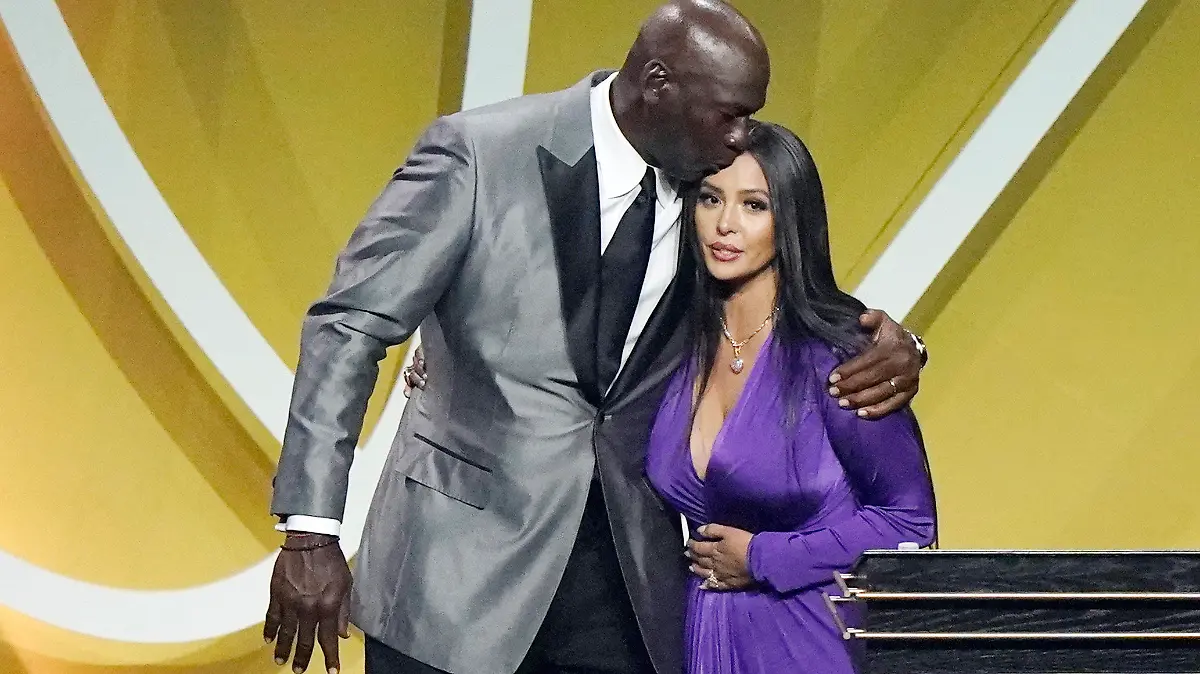Presenter Michael Jordan kisses Vanessa Bryant on the head after Bryant spoke on behalf of her late husband, Kobe Bryant, after Bryant was enshrined as part of the 2020 Basketball Hall of Fame class Saturday, May 15, 2021, in Uncasville, Conn. (AP Photo/Kathy Willens)